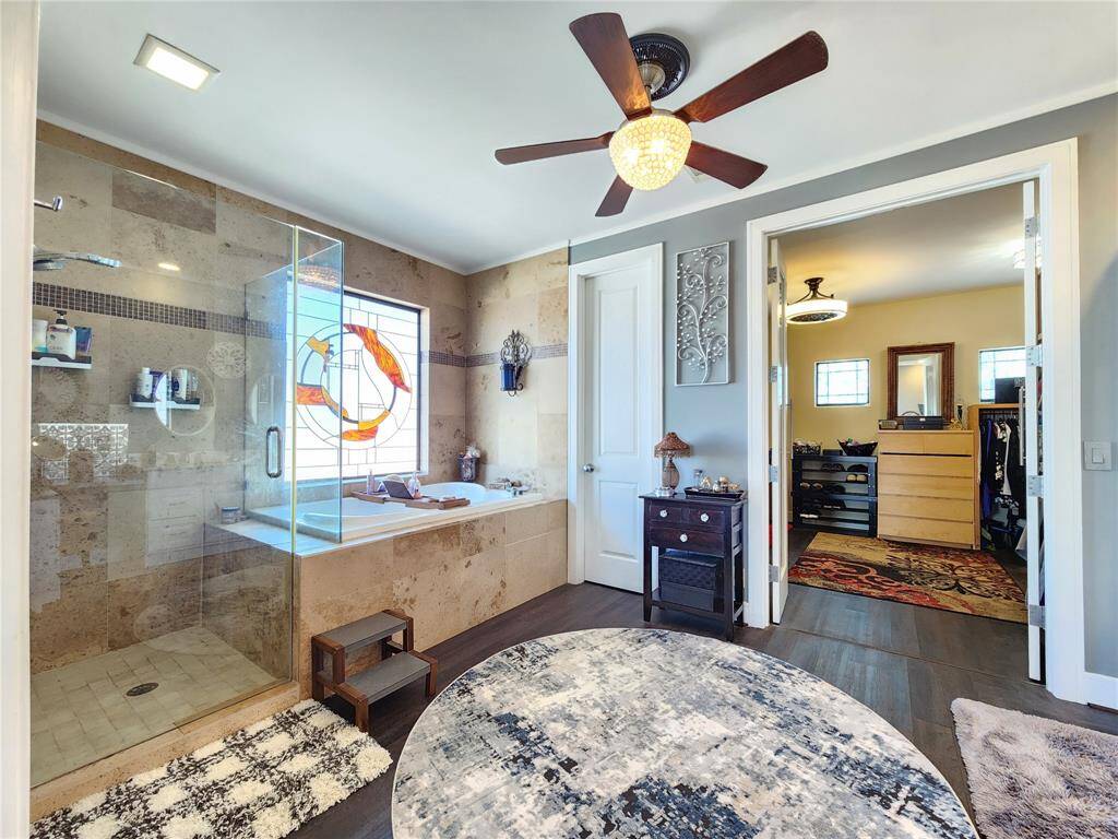 Large jacuzzi with stone shower.