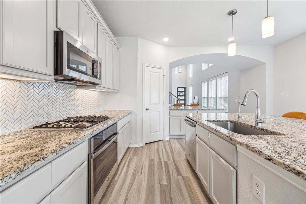 The large functional chef's kitchen with Kentmore Cabinets will inspire cooking and entertaining