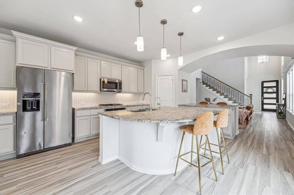 The large functional chef's kitchen with Kentmore Cabinets will inspire cooking and entertaining