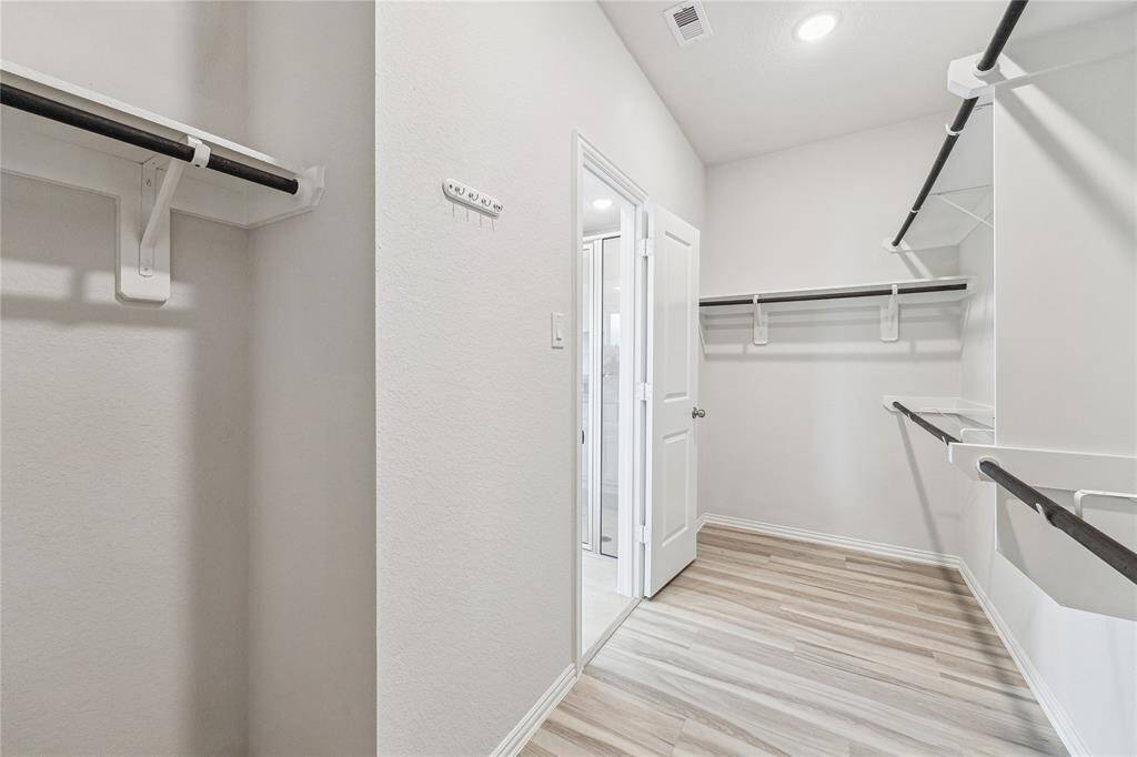 En-suite with double vanities, separate tub and shower and a large walk-in closet that make morning routines fast and easy.