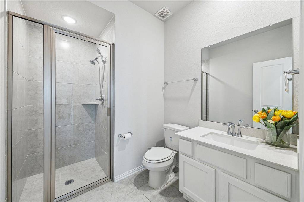 Downstairs you will also find a secondary bedroom with a full bath, that can also serve as an office space.
