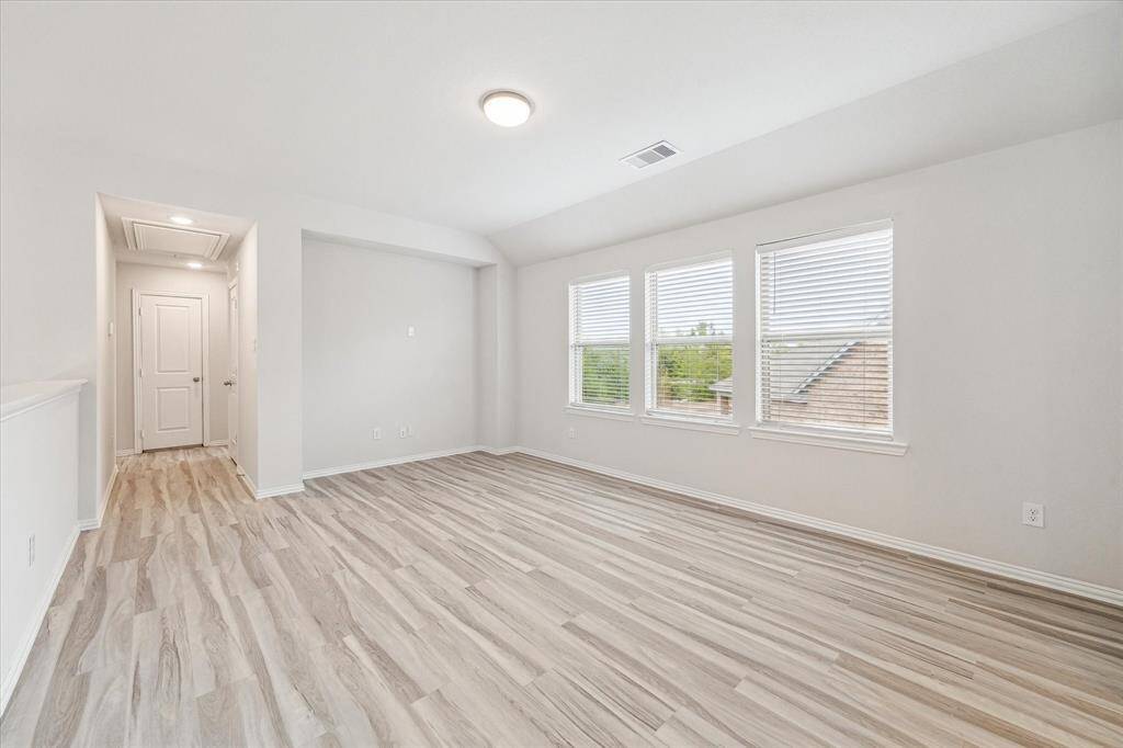 Downstairs you will also find a secondary bedroom with a full bath, that can also serve as an office space.