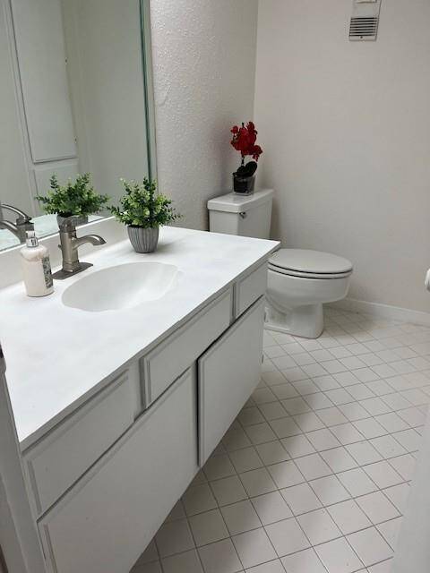 Secondary bathroom upstairs that has a tub and shower combo