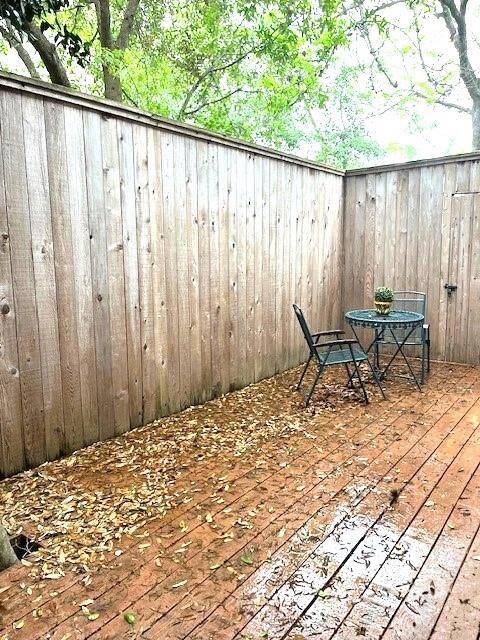 Large back patio/wooded deck with gorgeous trees