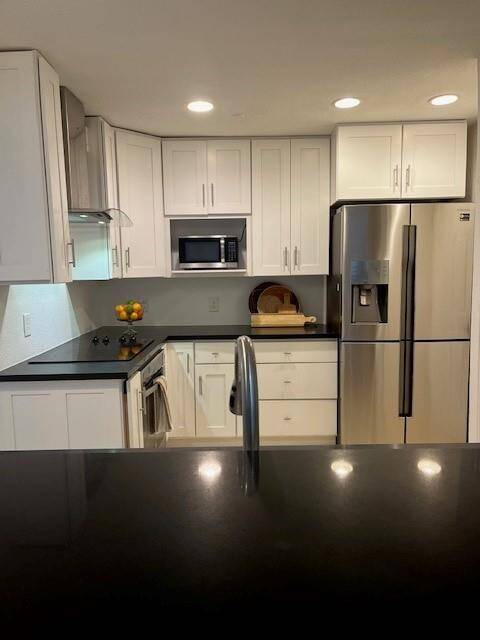 Kitchen with granite counters and stainless steel appliances.