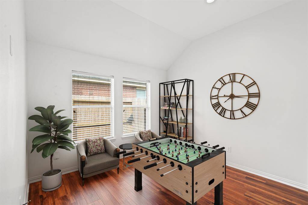 Multi-use space or game room situated between secondary bedrooms