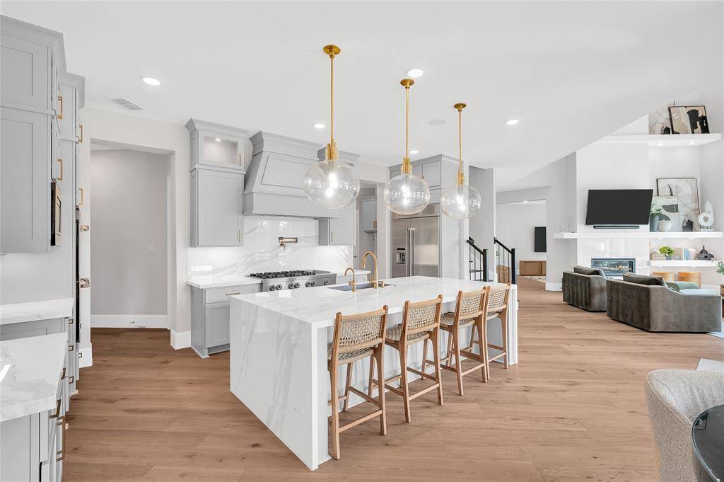 Open floor plan with views into the family room and den/game room.