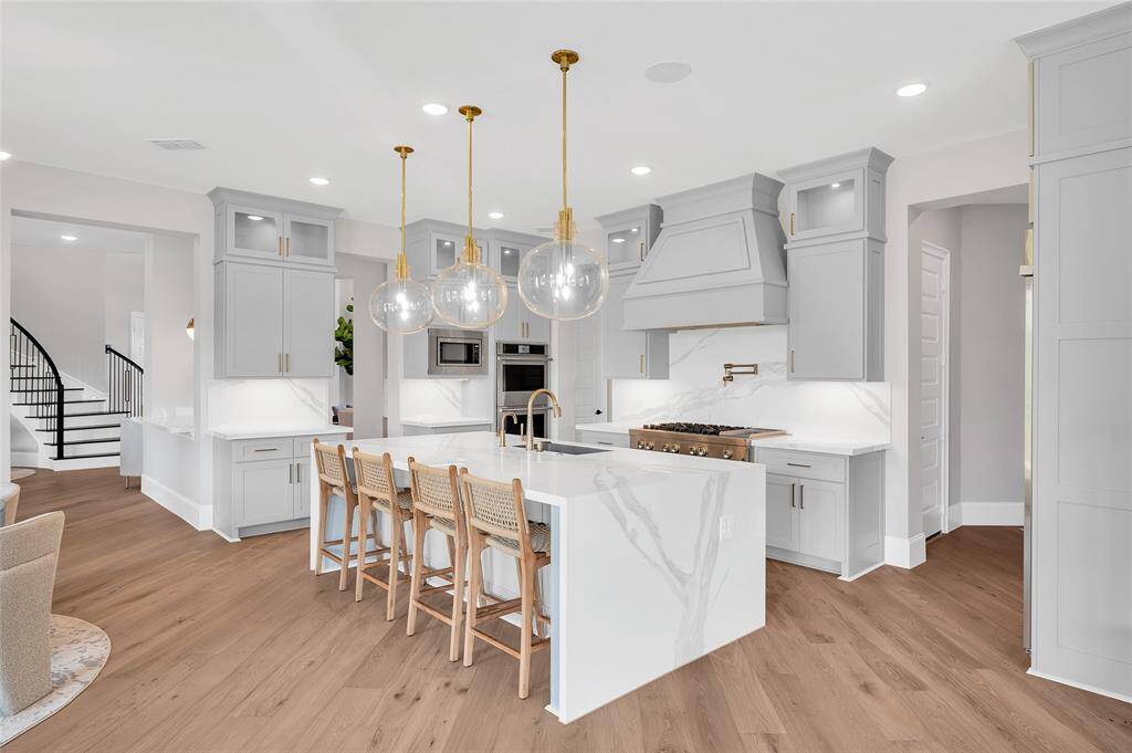Ample cabinet space and countertops with a large walk-in pantry.