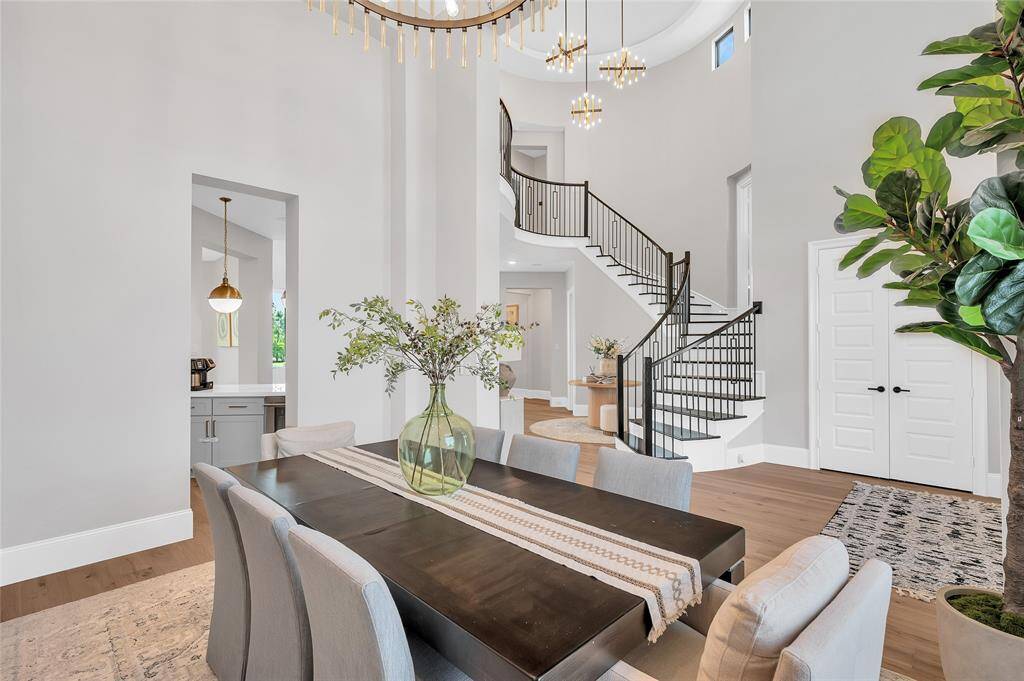 Formal dining room with direct access to the kitchen and butler's pantry, gracefully open to the foyer and a stunning circular staircase.