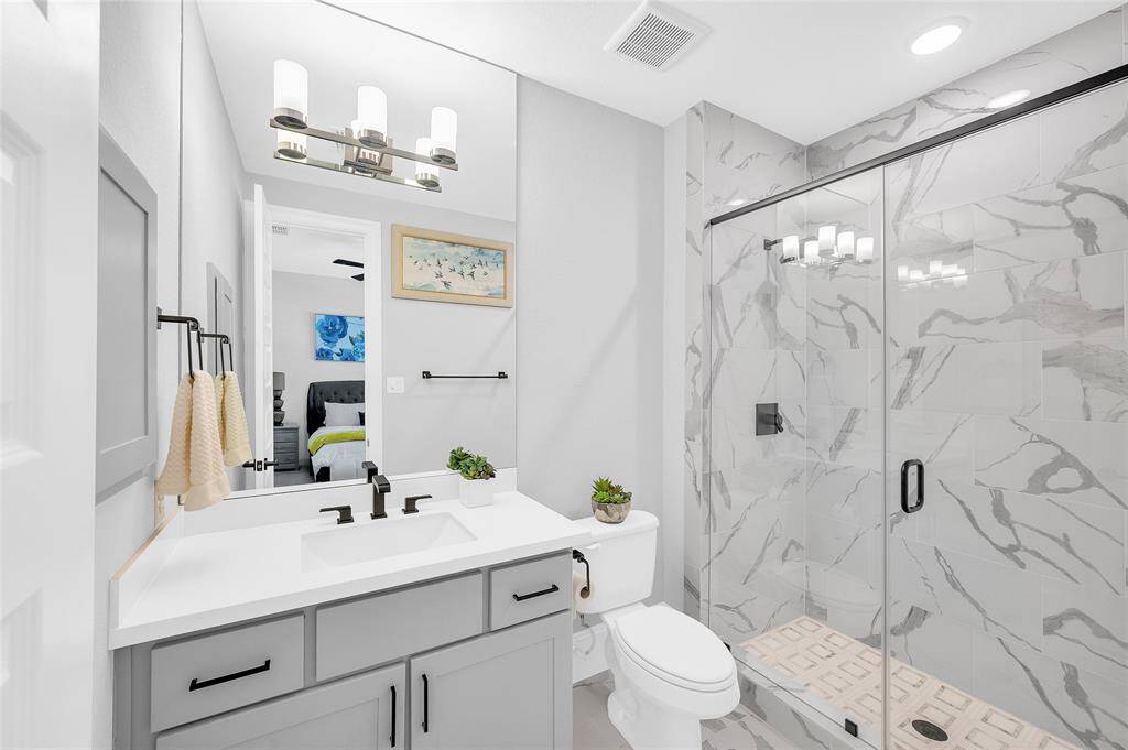 Ensuite bath in the Second main floor bedroom ensuite bath with custom details.