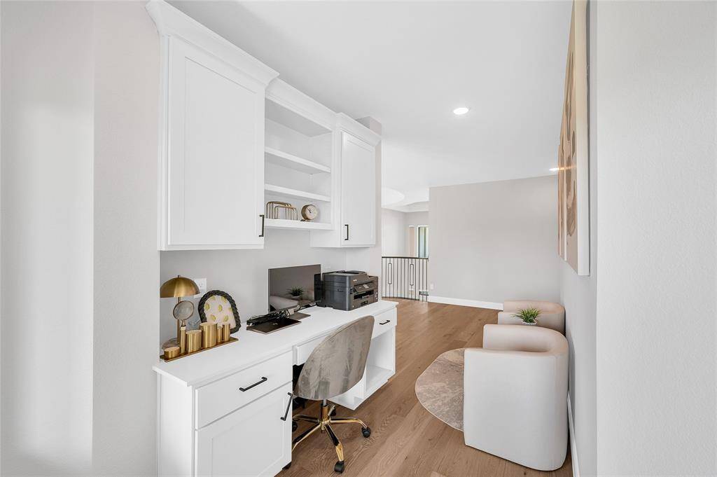 Second level features a built-in desk and sitting area.