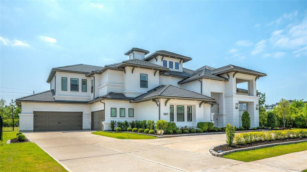 Upgraded 4-car garage with separate 50 amp charging stations in each garage.