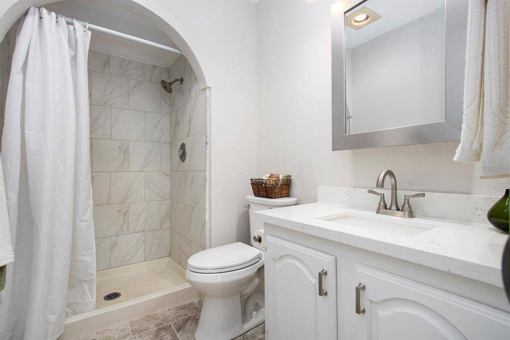 Primary Bath - New Toilet, Sink and Countertop, Faucet and Medicine Cabinet - Painted Cabinet with added Hardware - Also new Towel Bar and Ring