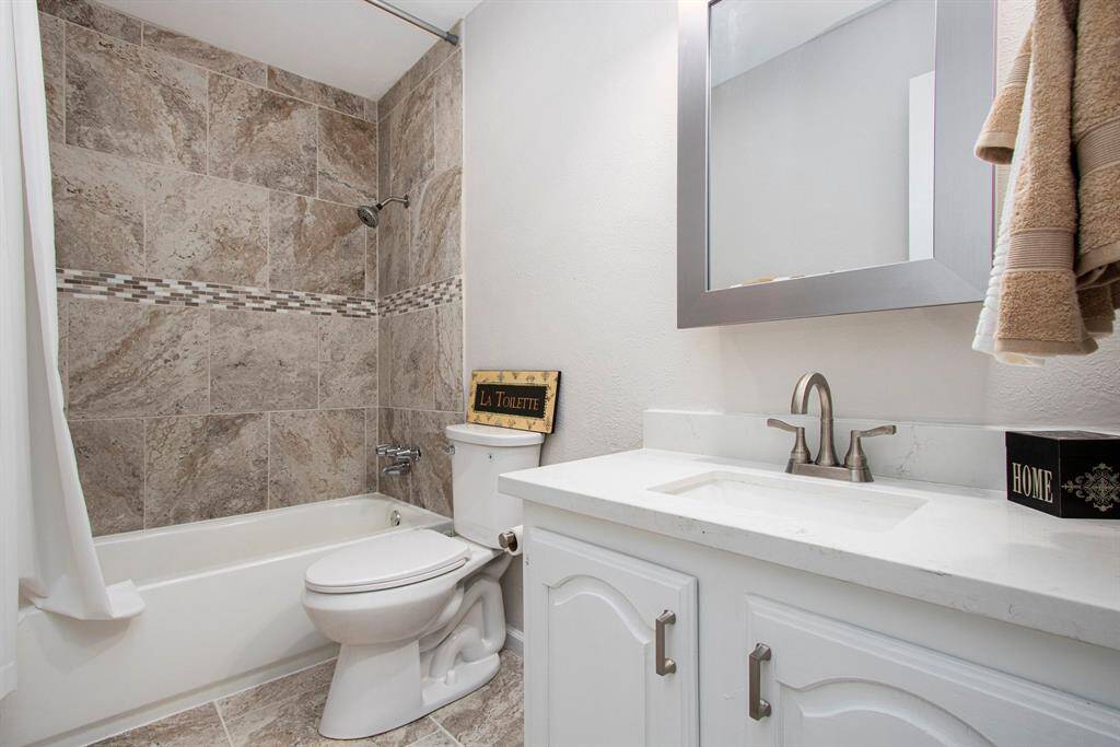 Secondary Bathroom - New Tub with Tile Surround, Toilet, Medicine Cabinet, Sink, Cabinet and Faucet, Towel Rod and Ring, Painted Cabinet with added Hardware