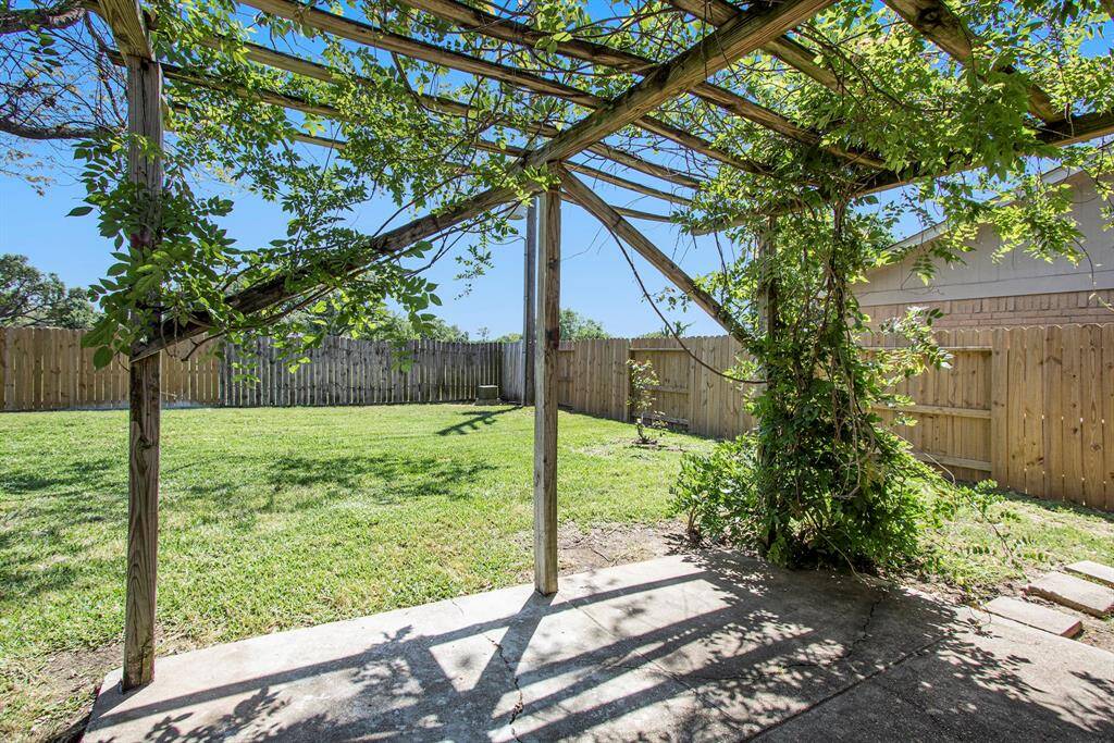 Back Patio is Covered with a Wisteria that Blooms in Early Spring