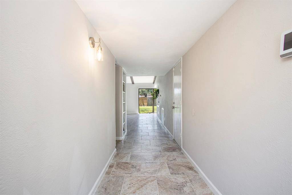 Long Entry with a Straight View to the Backyard.
