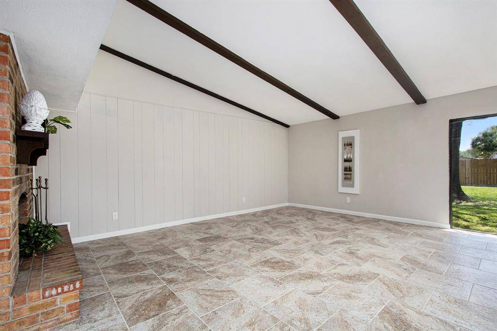 Family Room with Recently Painted Wood Paneling Walls, Ceiling Plus New Flooring