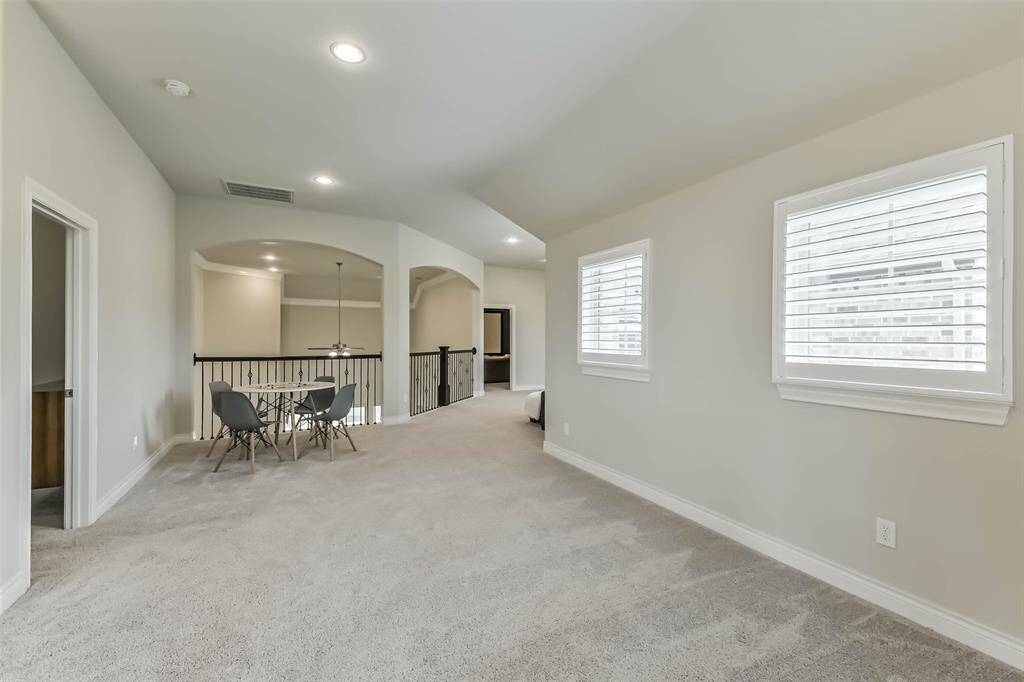 Upstairs space towards main game room area. Great for additional storage space, toy boxes, home school desks, open to the imagination.