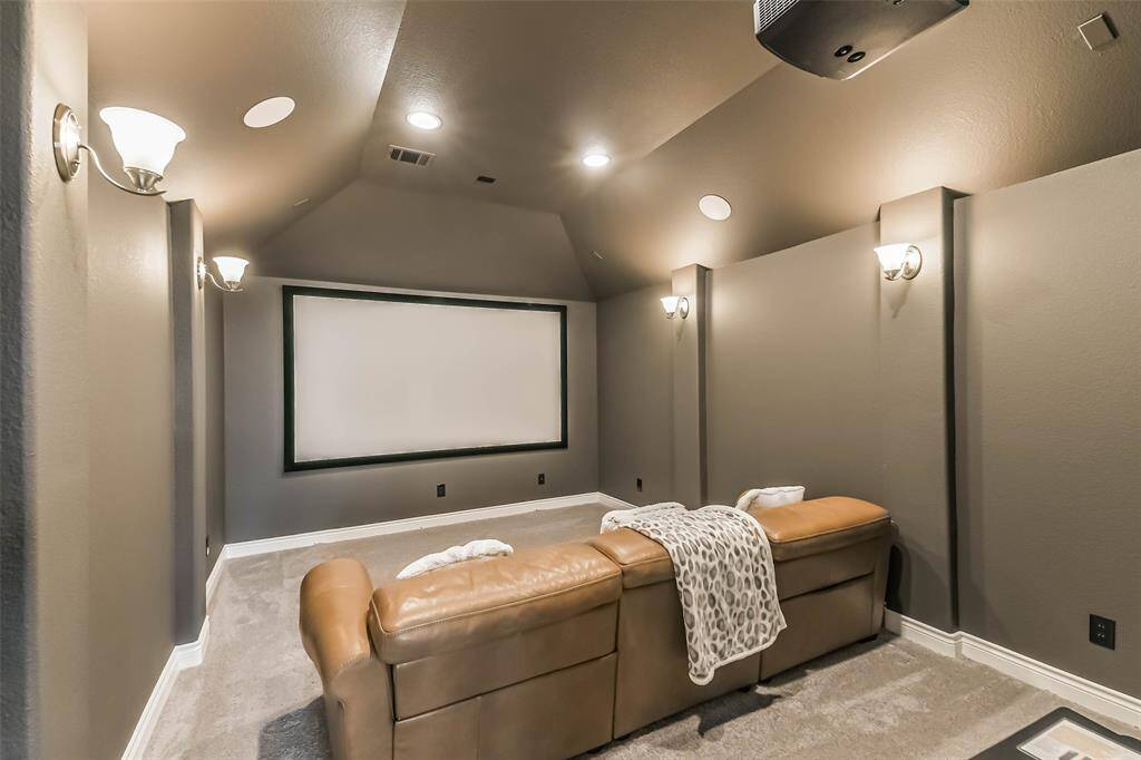 State of the Art Home Theater Complete with Projector, Immersive 7.1 surround sound multi-speaker system.