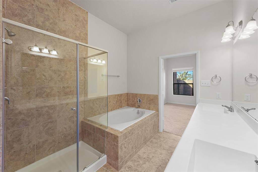 Primary Ensuite bath- separate shower and soak tub and DUAL sinks.