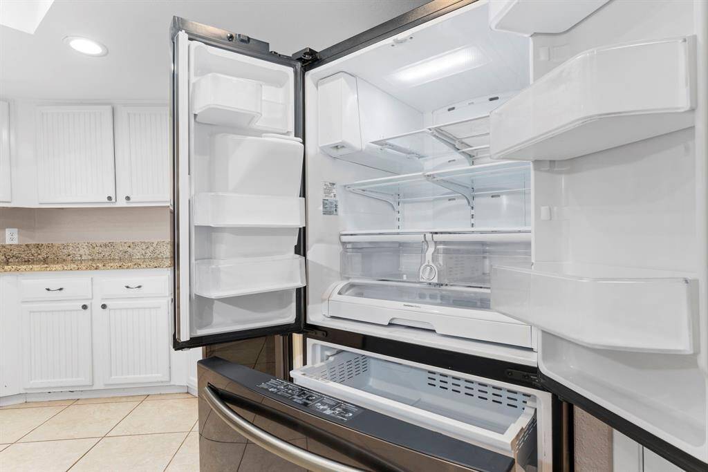 New 3 Door French Door Refrigerator with Dispenser - PrintProof Black Stainless Steel.  Washer and dryer included.