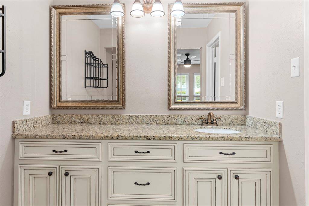 Granite countertops with such beauty boast the custom farmhouse style custom cabinets.