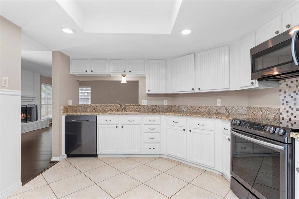 The Gourmet kitchen is amazing with beautiful granite countertops!  Deep undermount sink! Large tile floors and stunning cabinets that will surround you!