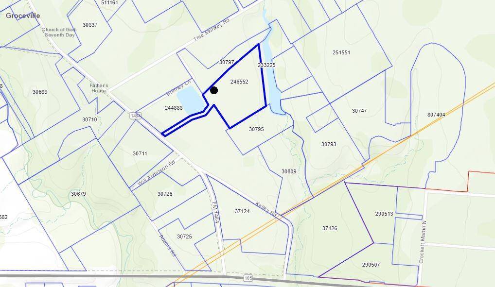 Property outlined in blue. The black dot shows approx. building location