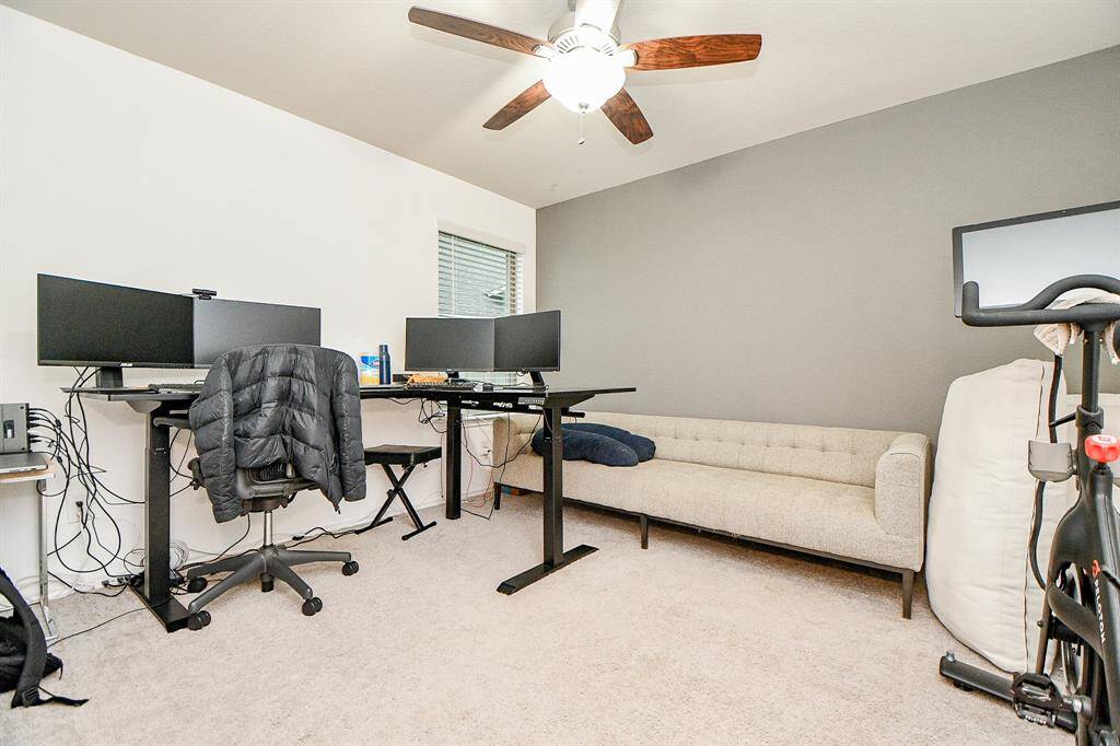 This guest bedroom turned office is a quiet, dedicated space designed for both productivity and comfort. With ample natural light streaming through the windows, it creates an inspiring environment for work or study. The neutral color palette and clean lines offer a professional yet inviting atmosphere. Whether you’re working from home, handling personal tasks, or simply seeking a peaceful retreat, this space could provide a functional need.