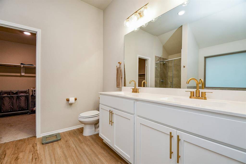The large mirrors and high-end finishes create a bright, airy feel.
