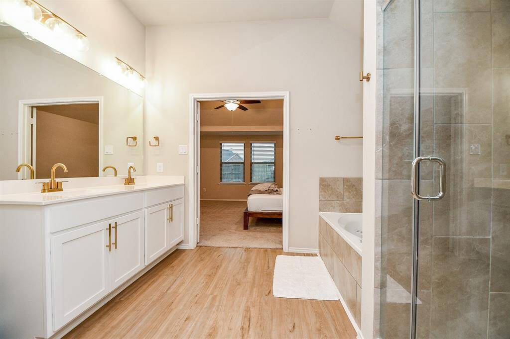 Thoughtfully designed for relaxation and functionality, this bathroom serves as an amazing compliment to the tranquil primary suite.
