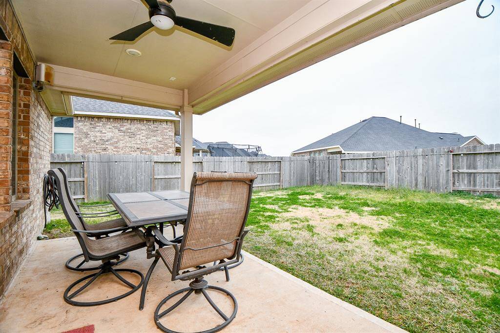 The covered patio adds an extra touch of comfort, making it a great spot for a morning coffee or unwinding after a long day.