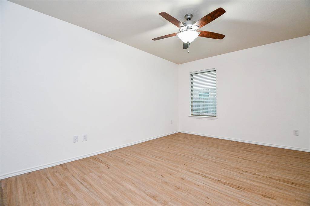The window allows natural light to brighten the room, while the open layout offers endless possibilities for customization. With plenty of room for seating, games, and entertainment equipment, this game room is the perfect space to unwind and enjoy quality time with loved ones.
