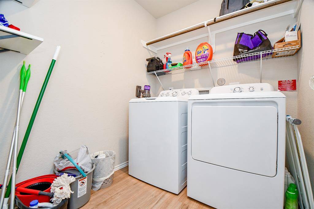 The laundry room is designed for both functionality and style. Spacious and well-lit, it offers plenty of room for efficient laundry days. Sleek cabinetry provides ample storage for essentials, while the well-placed washer and dryer connections ensure convenience. A neutral color palette and quality finishes create a clean, organized atmosphere, making laundry tasks feel effortless.