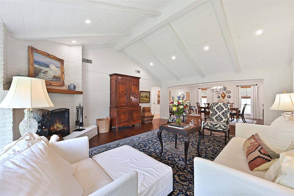 Natural light abounds with recessed lighting and a wall of windows looking out to your gorgeous backyard.