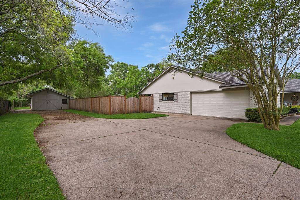 Your extended driveway leads to your attached garage and barn. To the left of the barn is an extra concrete pad for additional parking.