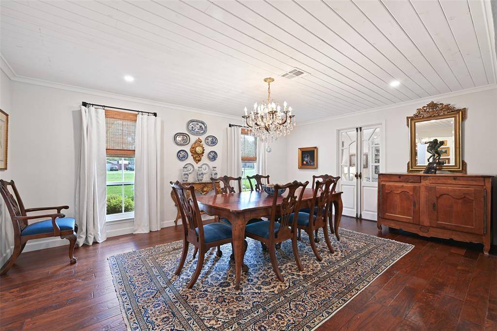 Upon entering, you are greeted by a grand entryway featuring travertine flooring, tongue and groove shiplap ceilings, custom lighting, and fresh interior Sherwin Williams paint.