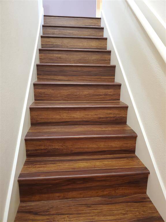 Look how beautiful the stairs are, brand new wood laminate stairs and floor upstairs