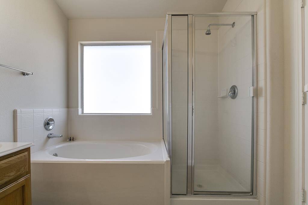 Master Bath with both bath tub and standing shower