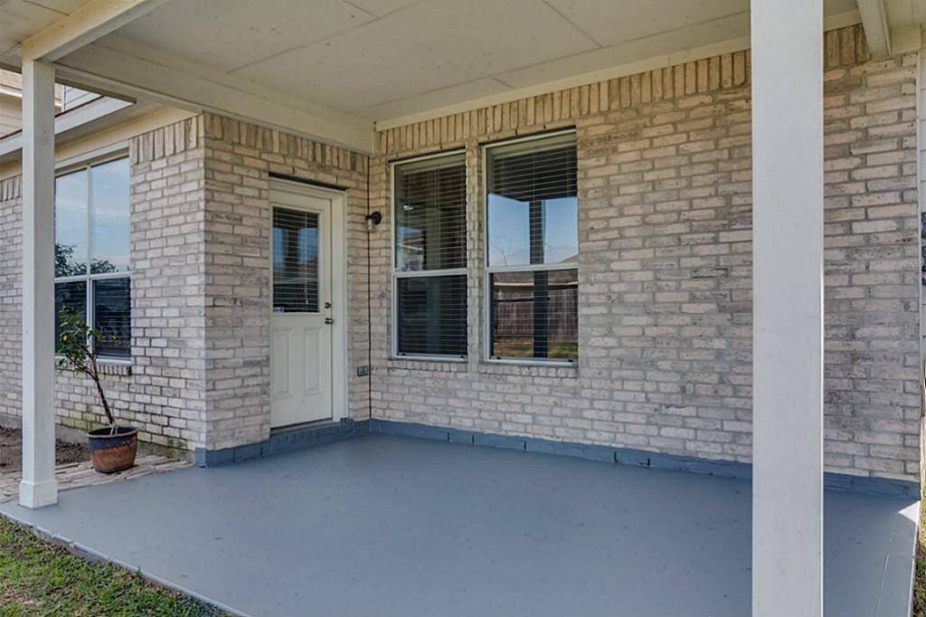 Covered patio in backyard, ready for a BBQ in summer yet?