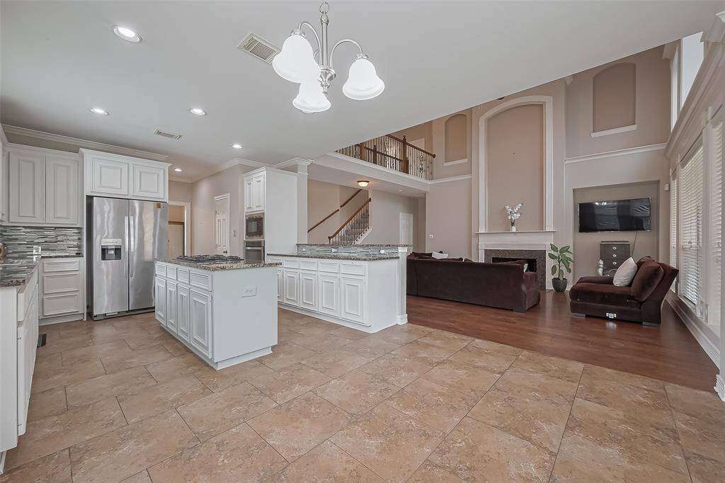 Breakfast area is open to living and kitchen. Great for flow of food for entertaining on the oversized covered patio