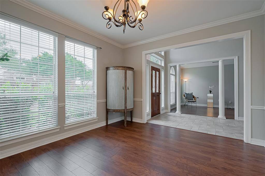 Huge window in the dining space with chandlier