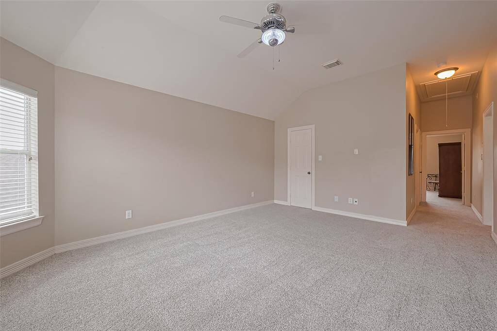Game room has cool fan with special lighting for entertaining open to hallway and third bathroom