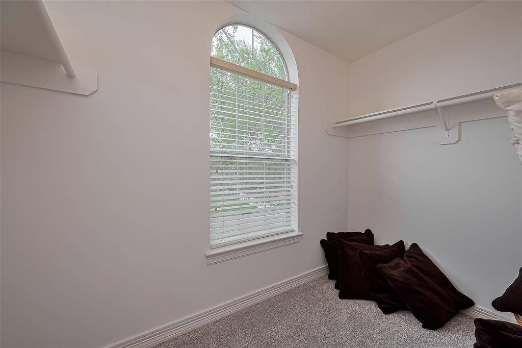 The walk in closet in this bedroom is large enough to have it's own window!