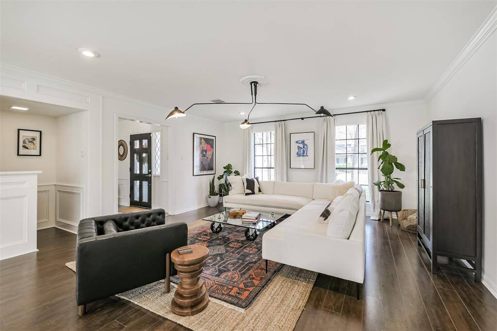 Updated lighting compliments the other updates throughout. The windows facing the front of the home fills the space with beautiful natural lighting.