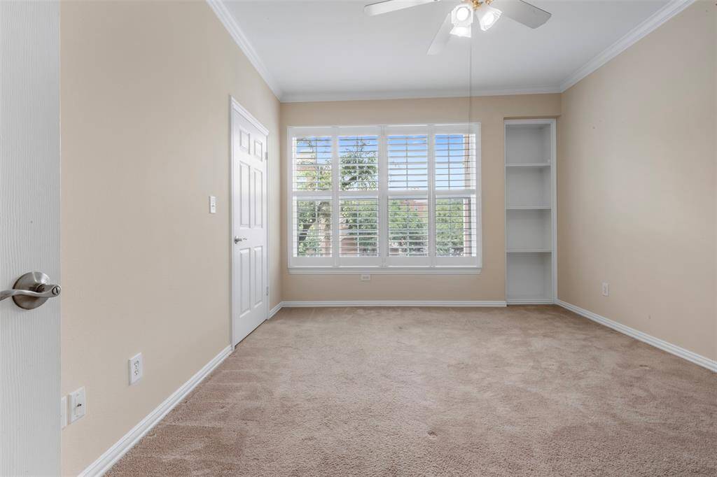 Primary bedroom with ensuite primary bathroom and walk-in closet
