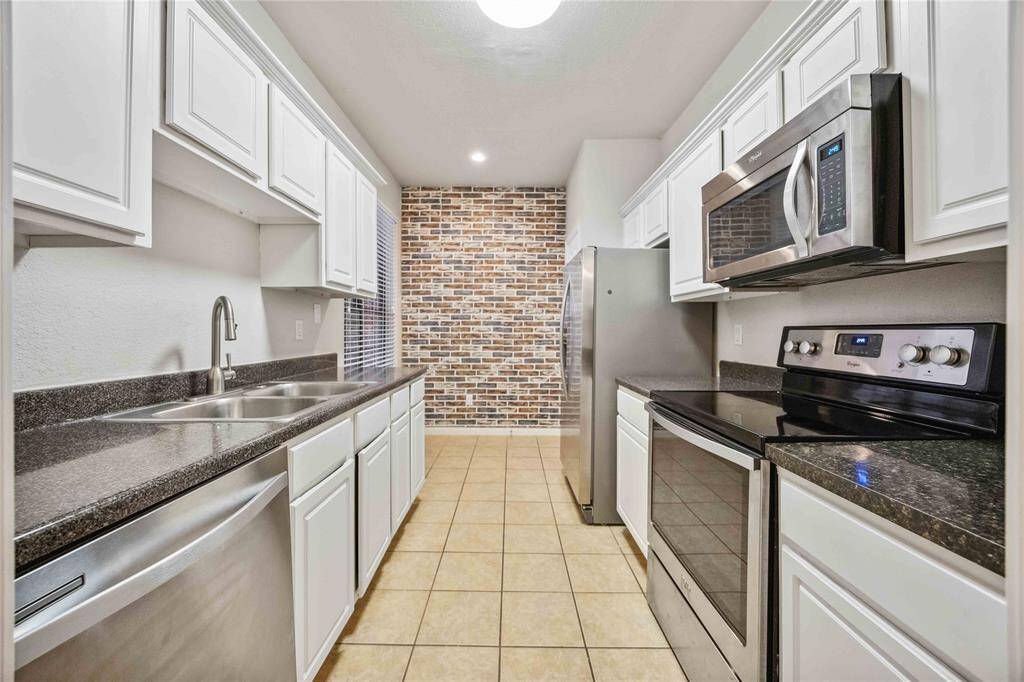Galley Kitchen with Stainless Steal Appliances