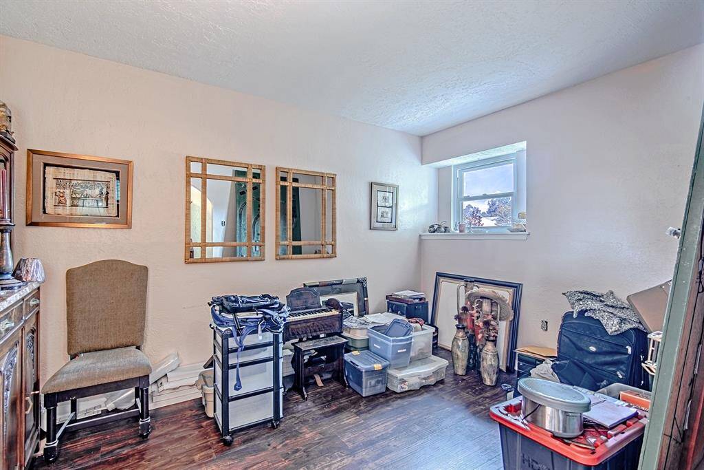 Versatile front room that can be used as a cozy den or home office.