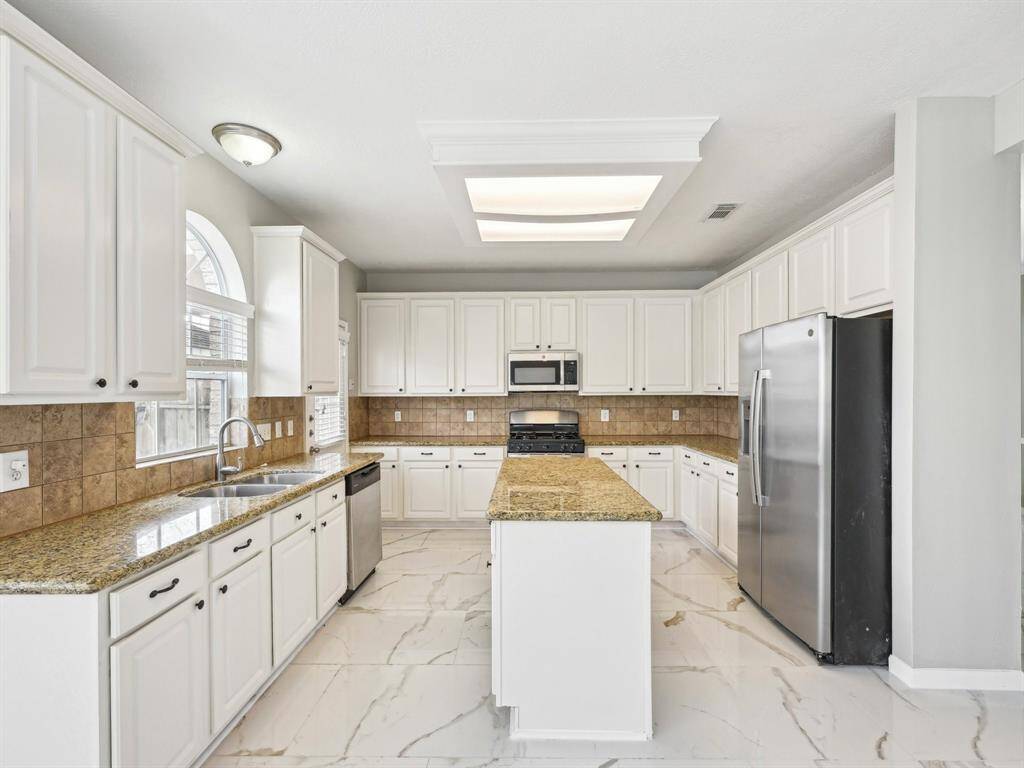 With an abundance of cabinetry and counter space, there is no shortage or storage or prep space here!