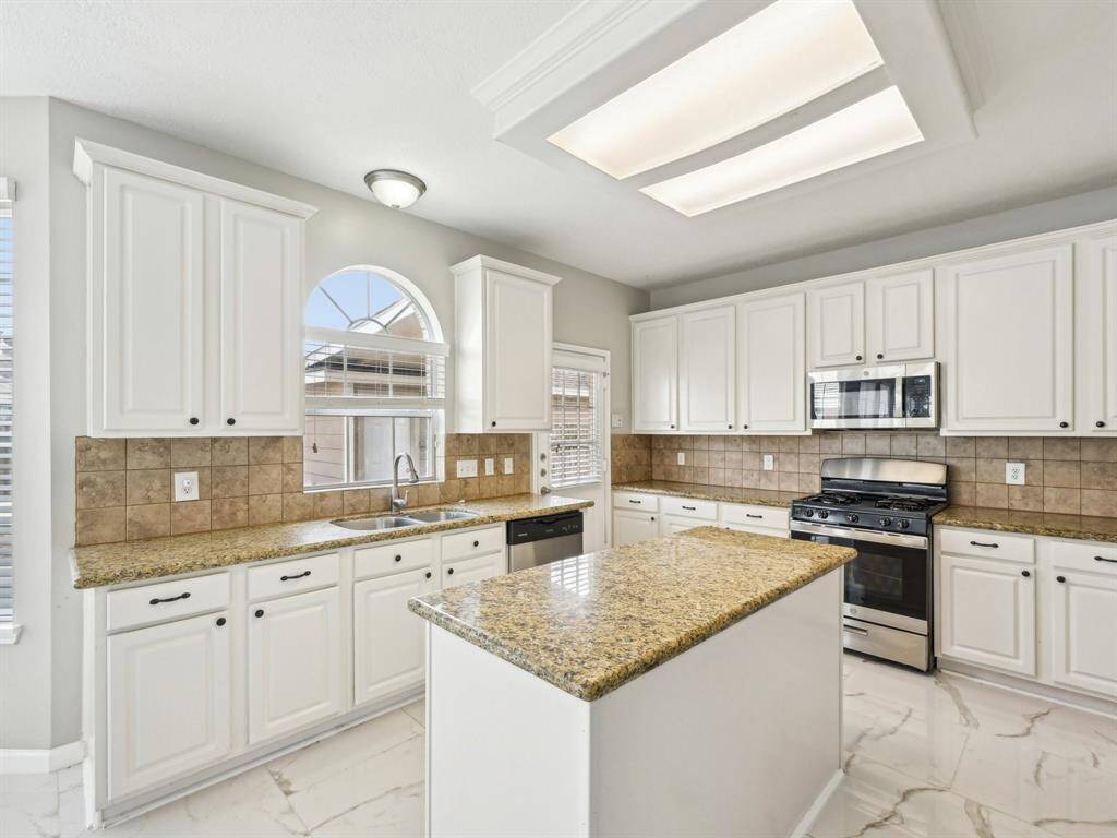 The island adds extra space for your cooking needs.